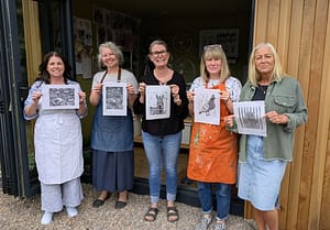 Lino printing workshop attendees outside studio
