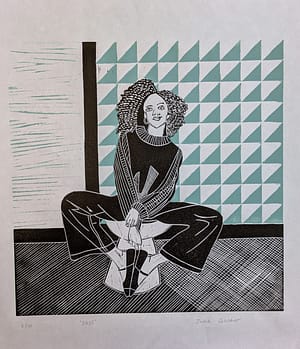 Lino print of a girl with curly hair sitting on a stool with a geometric backdrop