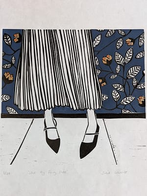 Hand made lino print of a girl's pointy shoes with a floral wallpaper background