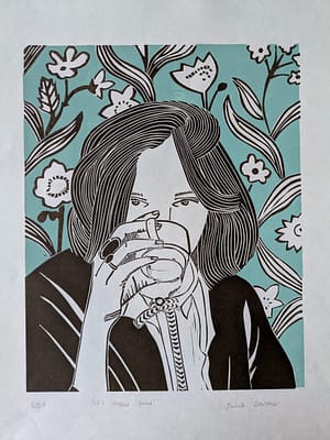 Lino print of a girl drinking a small cup of coffee