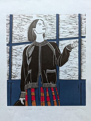 Lino print of a girl striking a pose in front of a blue door.