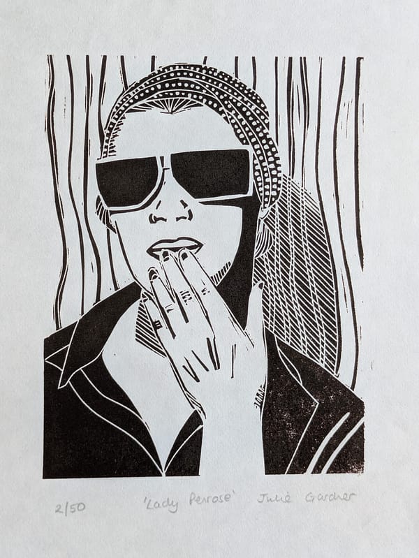 Lino print of Lee Miller in Van Dyke brown