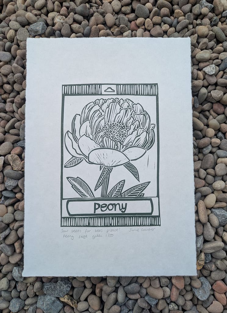 Lino print of peony seed packet by Julie Gardner