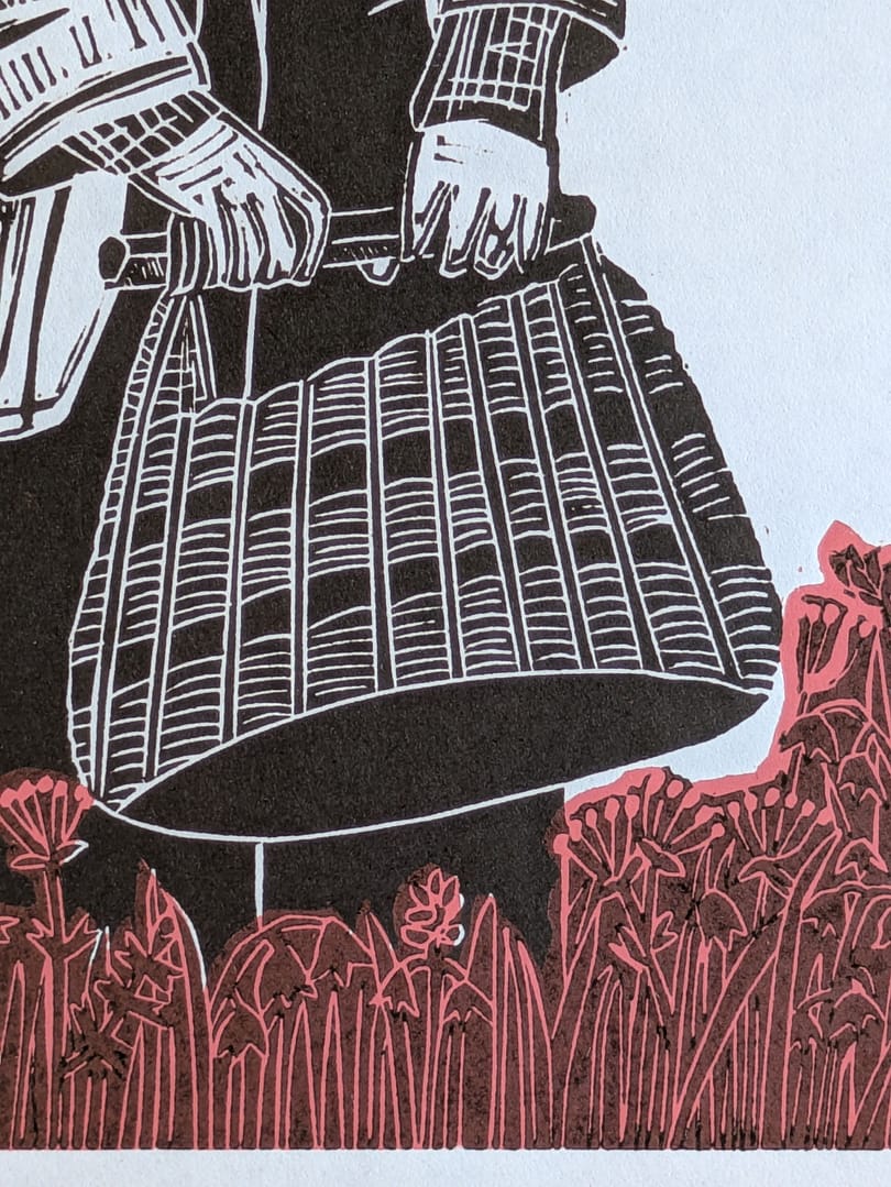 Lino print of a girl holding a basket in a flower meadow