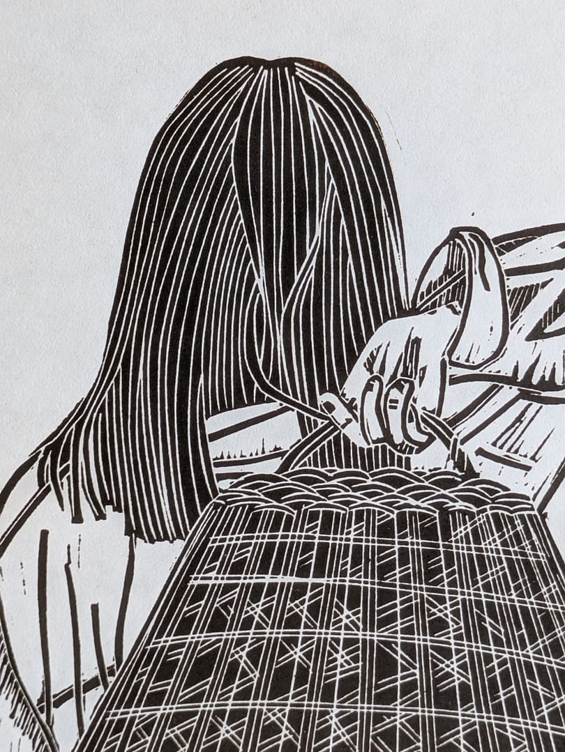 Lino print of a girl holding a large woven basket